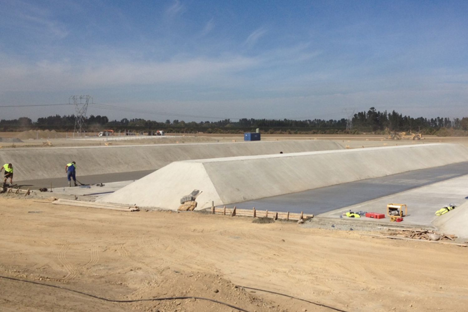 Large concrete silage bunker with sloped walls on a rural site, Ashburton